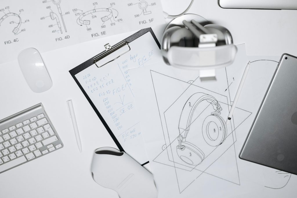 pexels photo 8000617 8000617 Top view of a workspace with headphone design sketches, keyboard, and mouse.